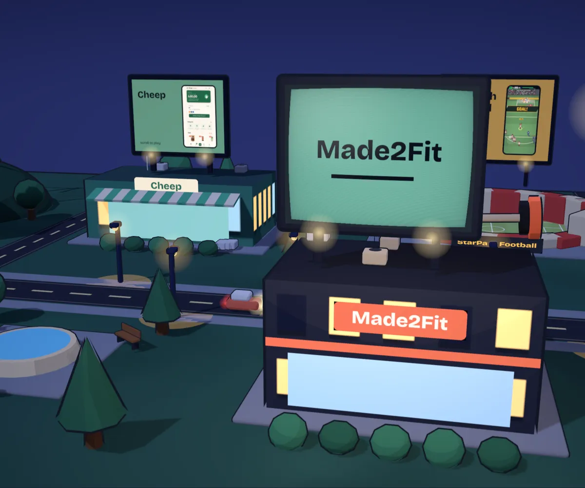 Made2Fit's building in the night town from the home page, its billboard playing the app